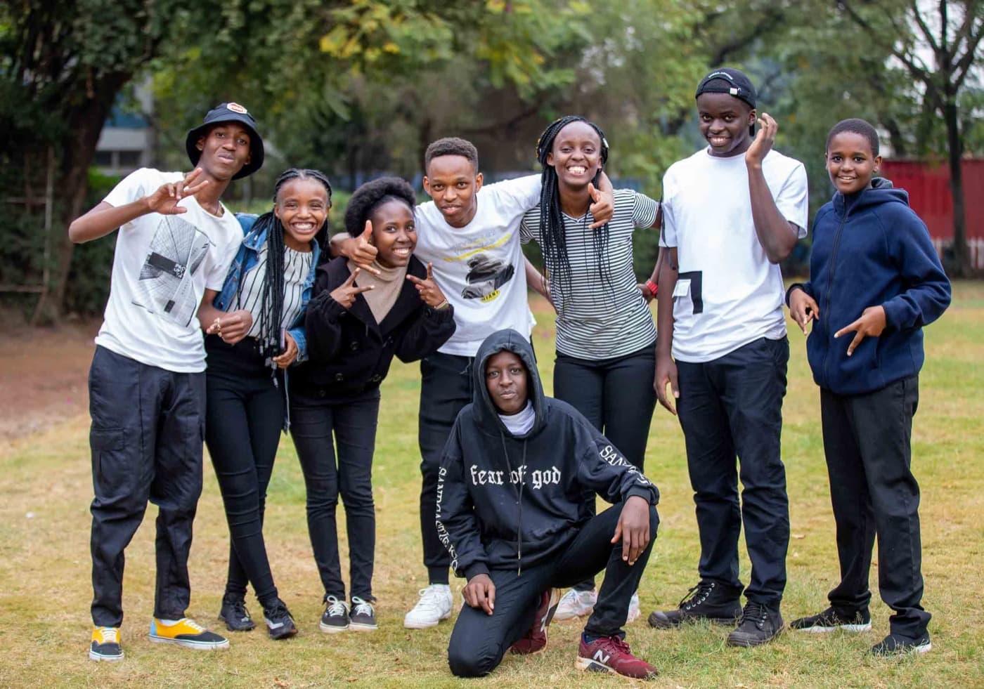 Group of happy teenagers smiling together outdoors