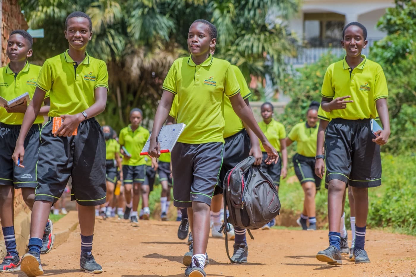 Students walking to school, smiling